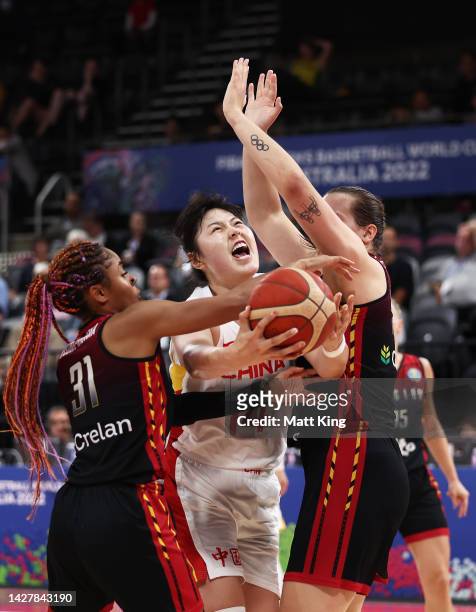 Yueru Li of China is challenged by Maxuella Lisowa Mbaka and Billie Massey of Belgium during the 2022 FIBA Women's Basketball World Cup Group A match...