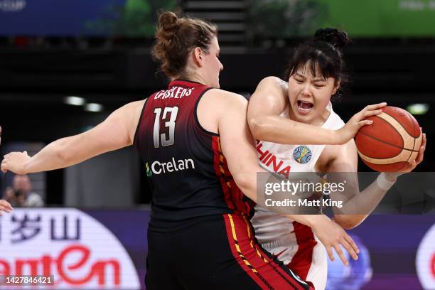 Yueru Li of China is challenged by Kyara Linskens of Belgium during the 2022 FIBA Women's Basketball World Cup Group A match between China and...