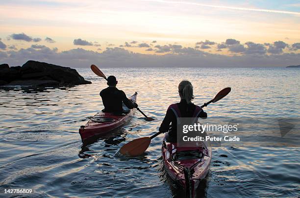 couple kayaking - kajak stock-fotos und bilder