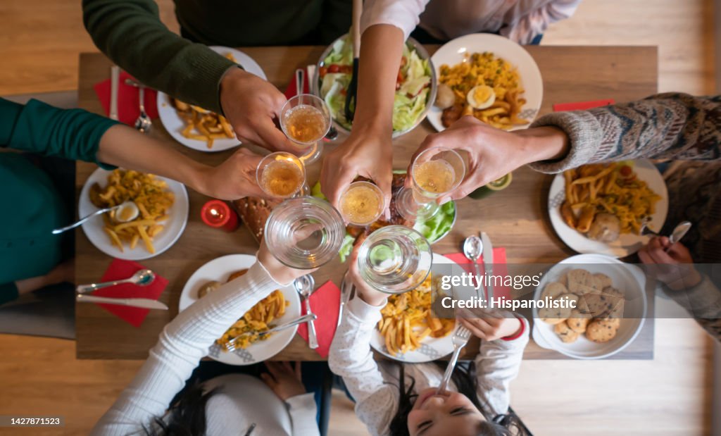 Close-up on a family making a Christmas toast while celebrating together