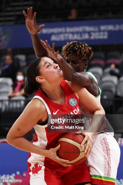 Natalie Achonwa of Canada is challenged by Kankou Coulibaly of Mali during the 2022 FIBA Women's Basketball World Cup Group B match between Mali and...