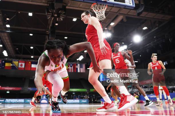 Djeneba N'Diaye of Mali is challenged by Bridget Carleton of Canada during the 2022 FIBA Women's Basketball World Cup Group B match between Mali and...