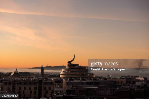 edinburgh city skyline during a misty sunset with a dramatic red sky in scotland, united kingdom, with famous monuments seen on the horizon - scotland winter stock pictures, royalty-free photos & images