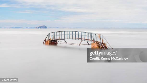 dunbar - bridge to nowhere - high tide stock pictures, royalty-free photos & images