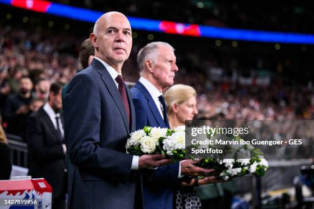 Bernd Neuendorf , President of the german footbal federation and Sir Geoff Hurst bring flowers prior to the UEFA Nations League League A Group 3...