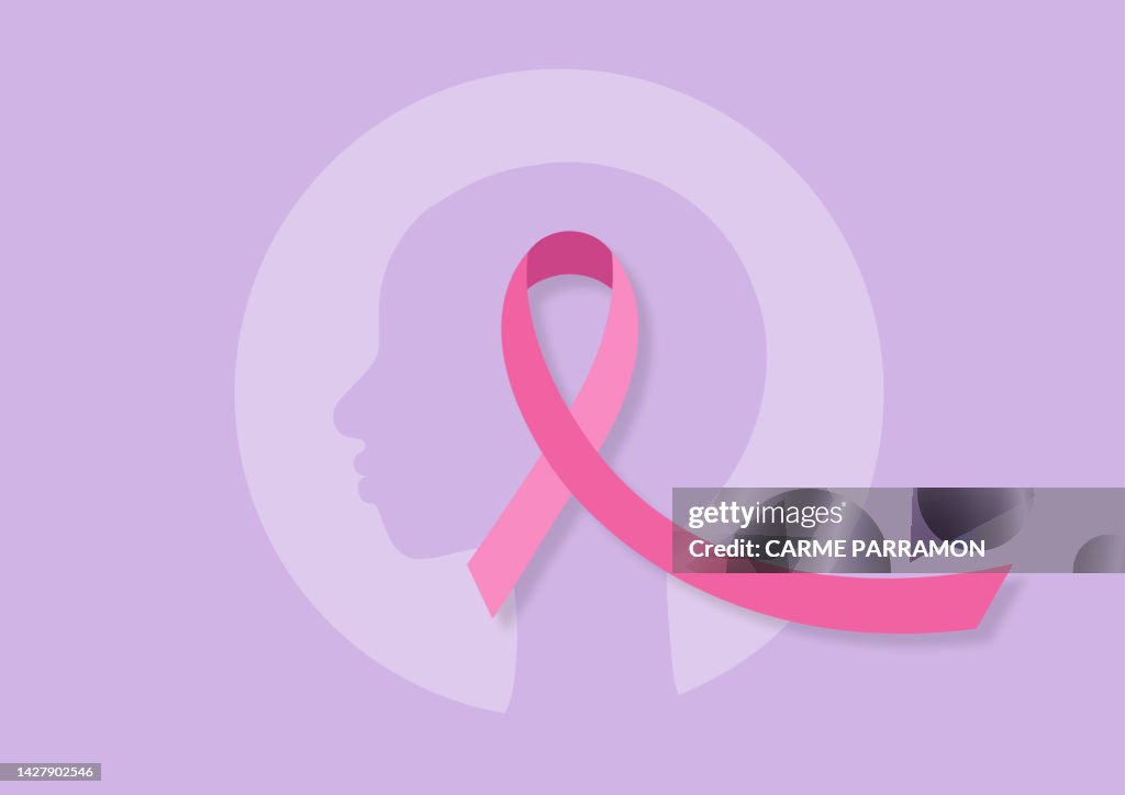 Une femme sans cheveux et avec un ruban rose. Cancer