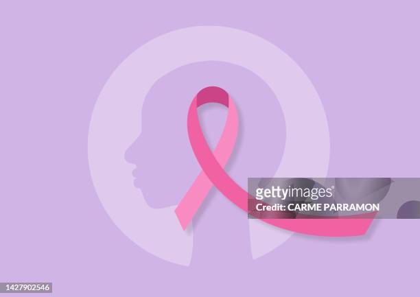 a woman with no hair and a pink ribbon. cancer - gynaecologist stock illustrations