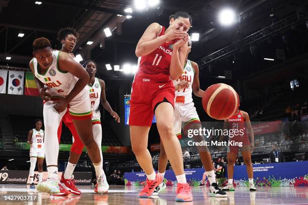 The arm of Salimatou Kourouma of Mali comes in contact with the face of Natalie Achonwa of Canada during the 2022 FIBA Women's Basketball World Cup...