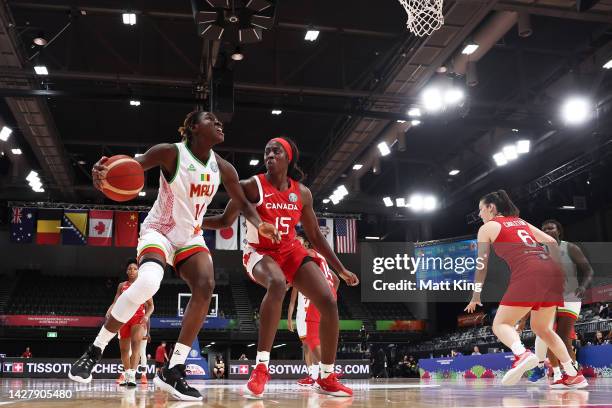 Sika Kone of Mali is challenged by Laeticia Amihere of Canada during the 2022 FIBA Women's Basketball World Cup Group B match between Mali and Canada...