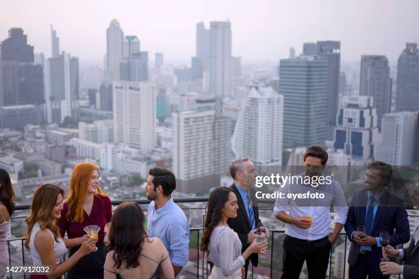 business celebration at rooftop bar in the city. - black tie event stock pictures, royalty-free photos & images