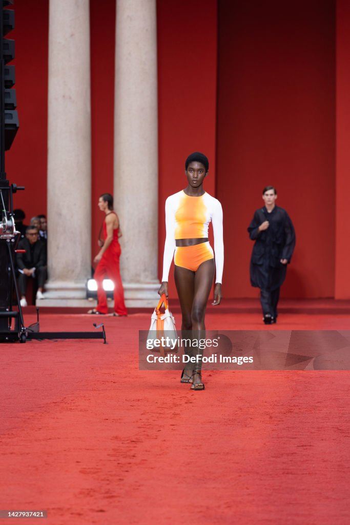 A model walks the runway of the Salvatore Ferragamo Fashion Show ...