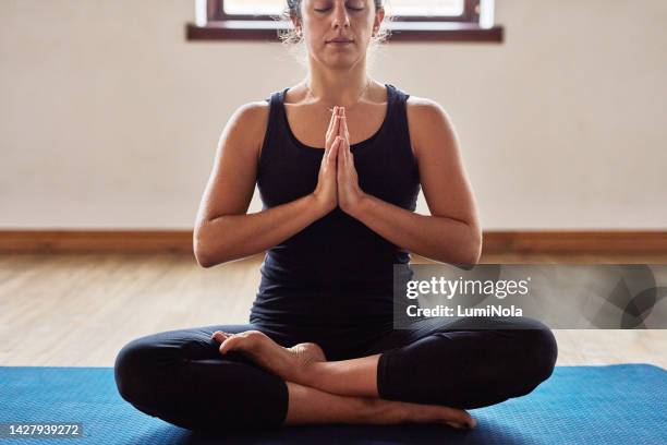 meditation woman doing yoga for relax at gym, calm for spiritual wellness zen and praying during training exercise on floor for balance. trust breathing, hope and faith doing fitness or pilates - namaste stock pictures, royalty-free photos & images