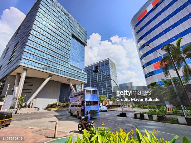 low angle view of modern office building against sky - mumbai street stock pictures, royalty-free photos & images