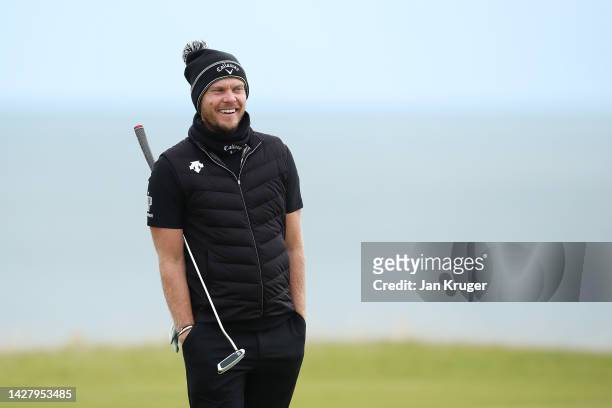 Danny Willett of England smiles on the 10th hole during a practice round prior to the Alfred Dunhill Links Championship at Kingsbarns Golf Links on...