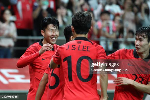Son Heung-Min of South Korea celebrates with team mates after scoring his team's first goal during the South Korea v Cameroon - International...