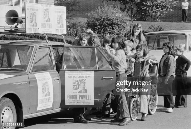 Local children gather around the campaign car of British politician Enoch Powell during campaigning for the Ulster Unionist Party for the South Down...