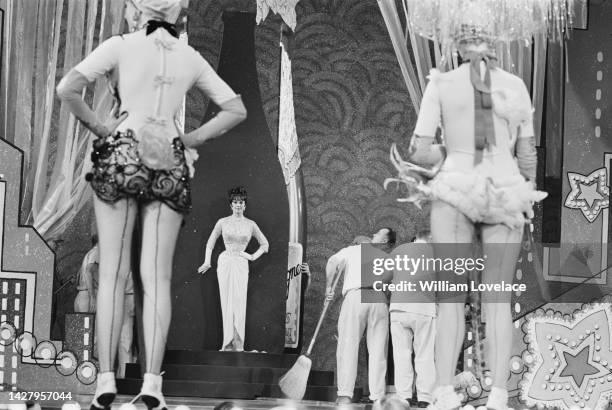 American actress Natalie Wood filming a scene for the musical 'Gypsy,' under direction from American film director Mervyn LeRoy at Warner Bros'...