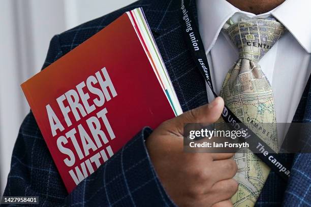 Man stands with the Labour Party Conference programme on September 27, 2022 in Liverpool, England The Labour Party hold their annual conference in...