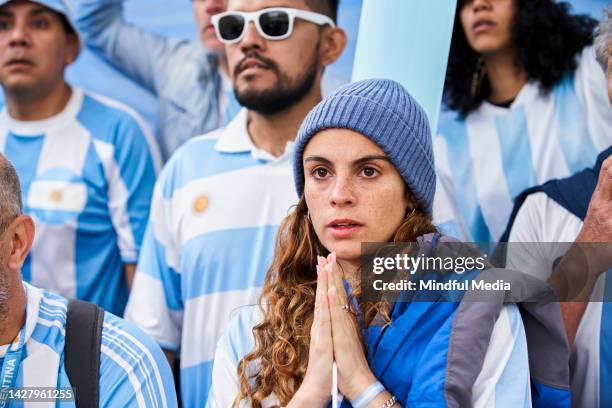 nervous argentinian female football fan watching match - argentina soccer imagens e fotografias de stock