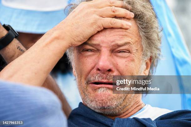 mature sport fan crying while watching match - defeat fear stock pictures, royalty-free photos & images