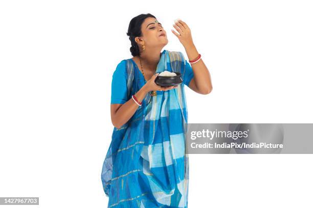 portrait of bengali woman having rosogolla - woman sweet food stock pictures, royalty-free photos & images