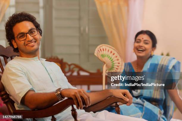 portrait of bengali couple sitting in bedroom - kurta stock pictures, royalty-free photos & images