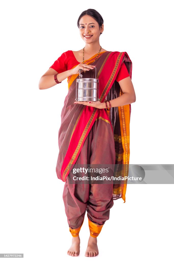 Portrait of a Maharashtrian woman with lunch box