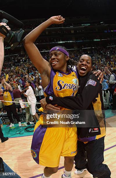Nikki Teasley and Nicky McCrimmon of the Los Angeles Sparks celebrate after Game two of the 2002 WNBA Finals against the New York Liberty on August...