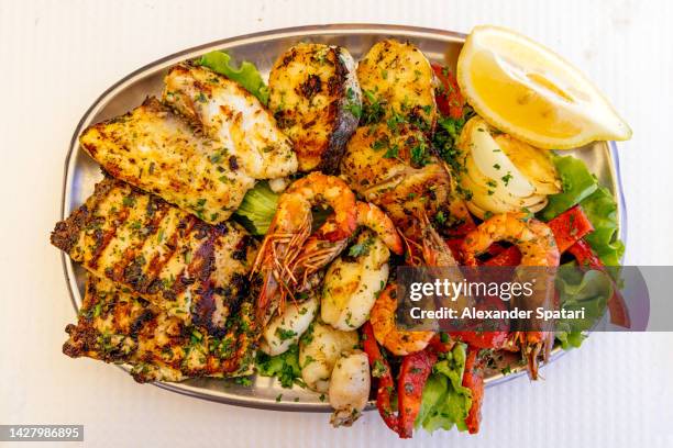 mixed seafood and fish served in a restaurant, directly above view - seafood platter stock pictures, royalty-free photos & images