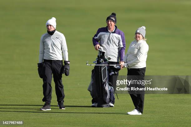 Matt Fitzpatrick of England looks on with his father Russell Fitzpatrick as his mother Susan Fitzpatrick plays a shot on the 1st hole during a...