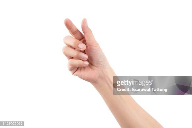 female hand holding a virtual card with your fingers on a white background - geste de la main photos et images de collection
