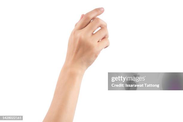 female hand holding a virtual card with your fingers on a white background - woman adult hand stock-fotos und bilder