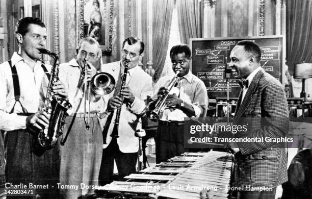 Five jazz greats perform together in this photographic postcard made circa 1950 in Berlin, Germany. They are Charlie Barnet, Tommy Dorsey, Benny...