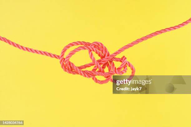 tangled rope - miteinander verbunden stock-fotos und bilder