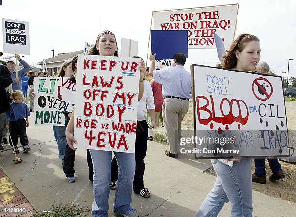 Protesters demonstrate outside the Sovereign Bank Arena where U.S. President George W. Bush was attending a fund-raiser for Senate candidate Douglas...