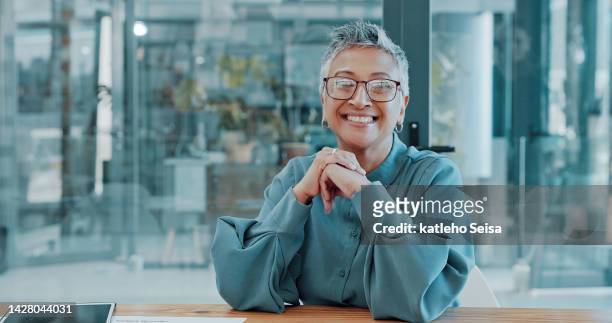 management face, corporate smile and woman working at business company, happy with success as manager and smile for professional workplace. mature ceo portrait with trust in startup vision at table - travel agency stock pictures, royalty-free photos & images