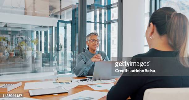 business meeting, job interview and women in office with laptop and financial documents. businesswoman and ceo at desk discussing startup performance and productivity reports with female staff member - business audit stockfoto's en -beelden