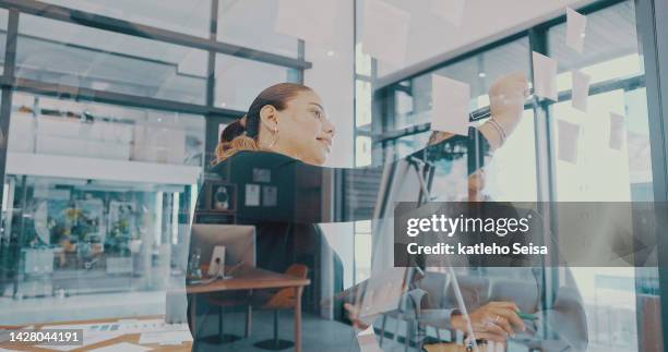 strategy, planning and creative meeting with business women working on sticky notes in a corporate office. vision, goal and innovation brainstorm with team writing idea and target mission plan - vogues forces of fashion conference stockfoto's en -beelden