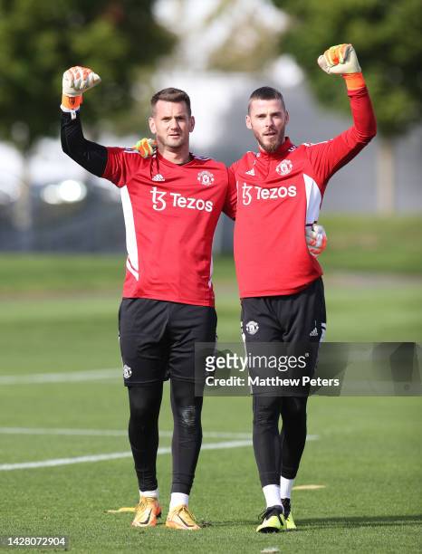 Tom Heaton, David de Gea of Manchester United in action during a first team training session at Carrington Training Ground on September 27, 2022 in...