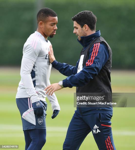 Arsenal manager Mikel Arteta talks to Gabriel Jesus during a training session at London Colney on September 27, 2022 in St Albans, England.