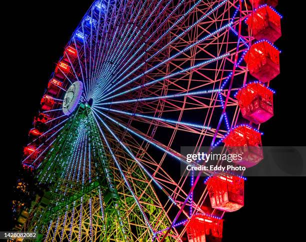 ferris wheel in the night - circus icon stock pictures, royalty-free photos & images