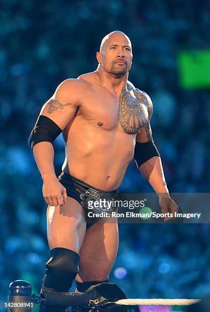 Dwayne ''The Rock'' Johnson looks on during his match against John Cena during WrestleMania XXVIII at Sun Life Stadium on April 1, 2012 in Miami...