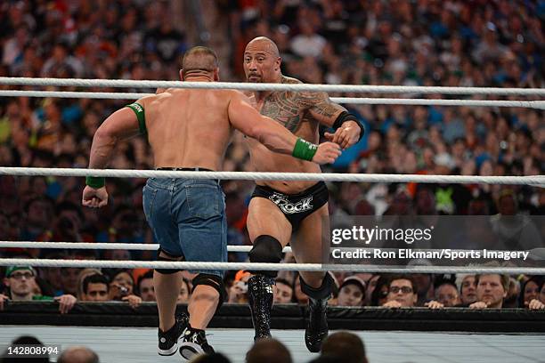 Dwayne ''The Rock'' Johnson and John Cena in action during WrestleMania XXVIII at Sun Life Stadium on April 1, 2012 in Miami Gardens, Florida.