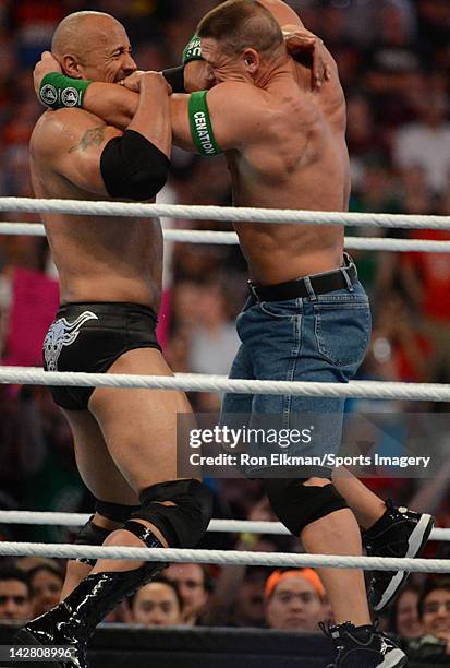 Dwayne ''The Rock'' Johnson and John Cena in action during WrestleMania XXVIII at Sun Life Stadium on April 1, 2012 in Miami Gardens, Florida.