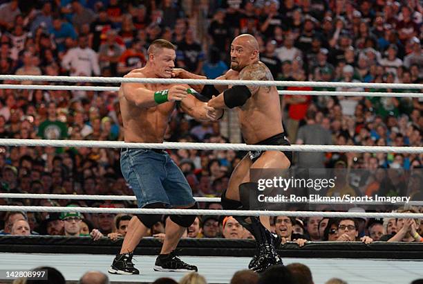 Dwayne ''The Rock'' Johnson and John Cena in action during WrestleMania XXVIII at Sun Life Stadium on April 1, 2012 in Miami Gardens, Florida.