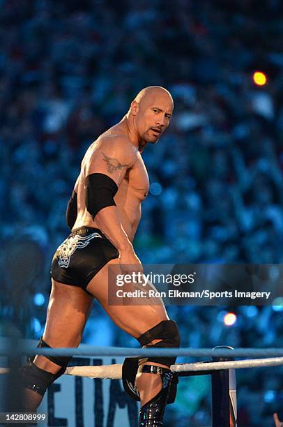 Dwayne ''The Rock'' Johnson looks on during his match against John Cena during WrestleMania XXVIII at Sun Life Stadium on April 1, 2012 in Miami...