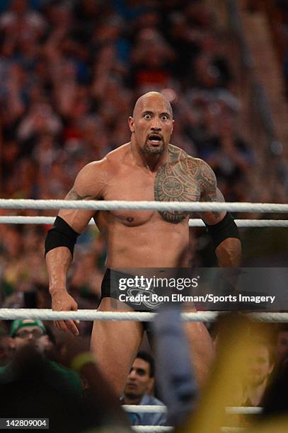 Dwayne ''The Rock'' Johnson looks on during his match against John Cena during WrestleMania XXVIII at Sun Life Stadium on April 1, 2012 in Miami...