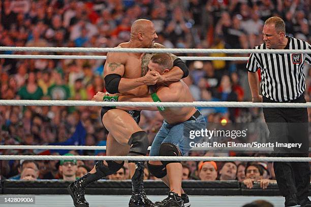 Dwayne ''The Rock'' Johnson and John Cena in action during WrestleMania XXVIII at Sun Life Stadium on April 1, 2012 in Miami Gardens, Florida.