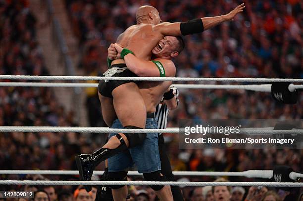 Dwayne ''The Rock'' Johnson and John Cena in action during WrestleMania XXVIII at Sun Life Stadium on April 1, 2012 in Miami Gardens, Florida.