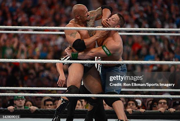 Dwayne ''The Rock'' Johnson and John Cena in action during WrestleMania XXVIII at Sun Life Stadium on April 1, 2012 in Miami Gardens, Florida.